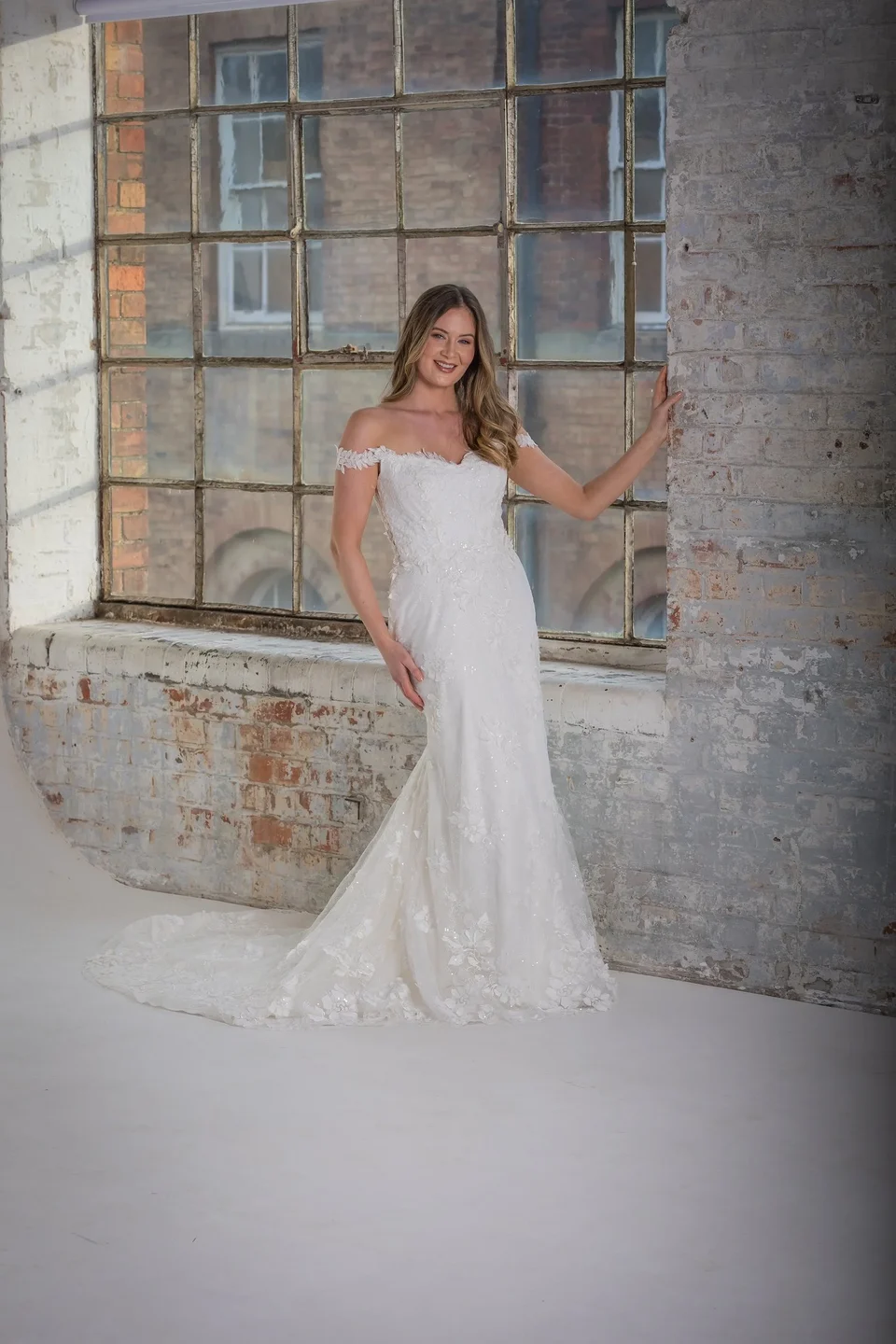Off-the-shoulder lace wedding dress from the Natalya James collection